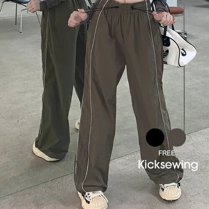 KICKSEWING（キックスウィング）ナイロンサイドラインジョガーパンツ